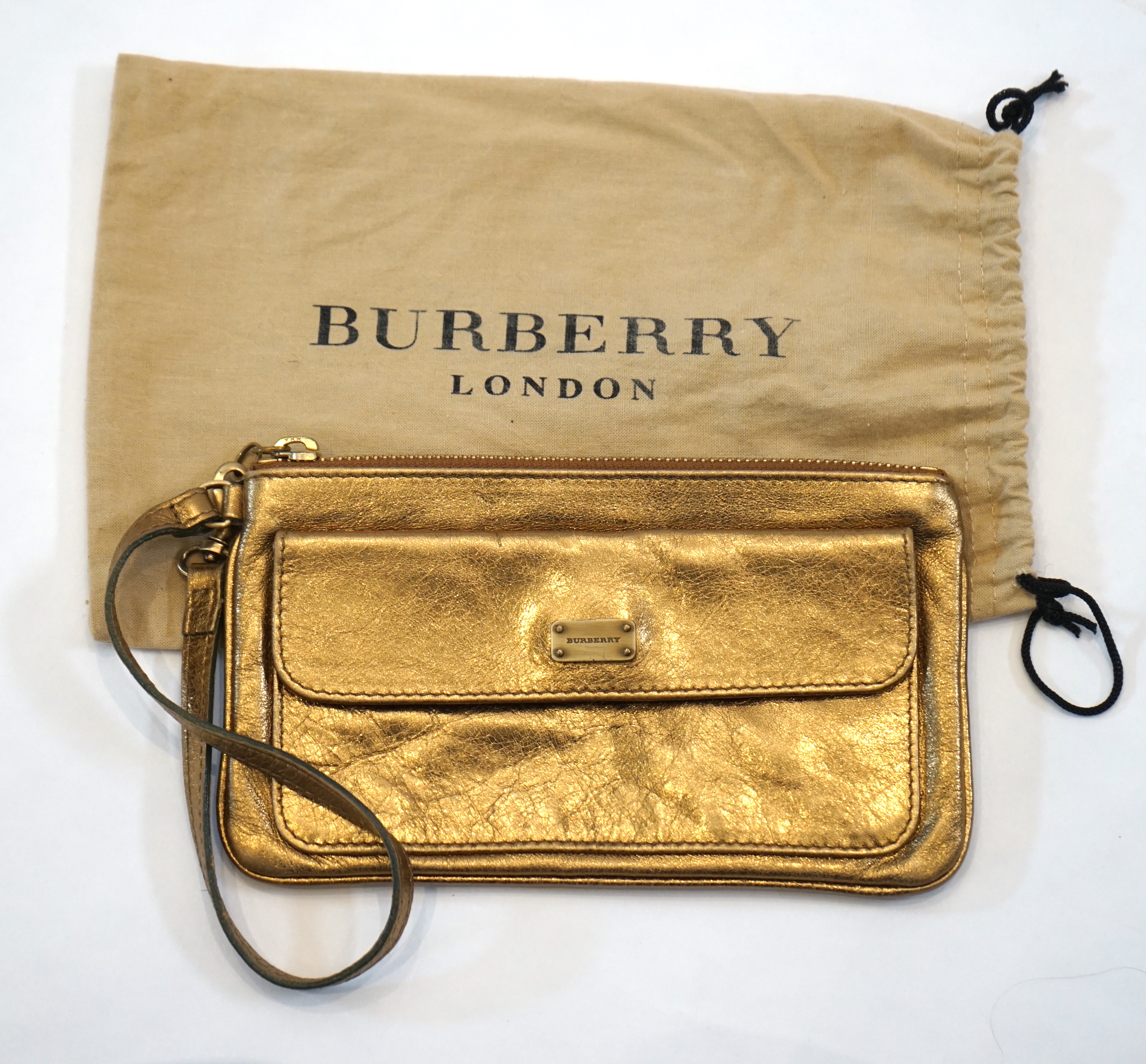 A Burberry gold leather clutch bag with original dust bag, approx length 19.5cm, height 11cm